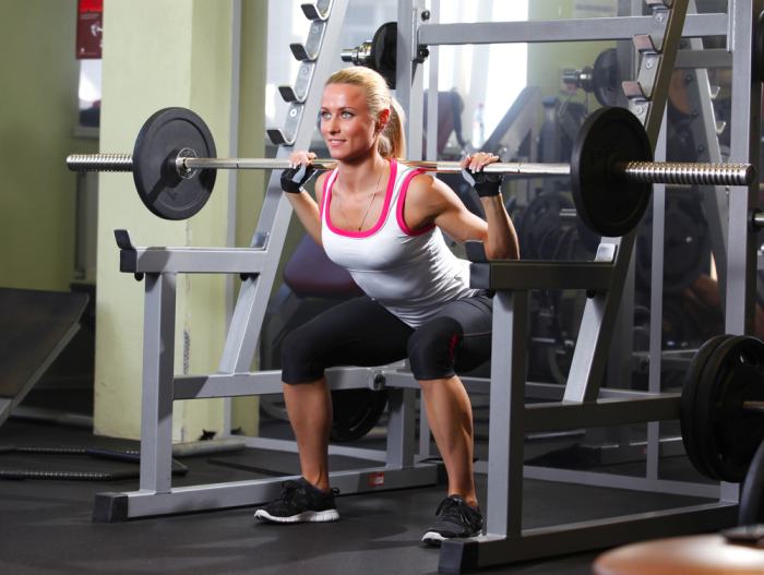 Make sure your squat technique includes squatting down until your quadricep muscles are parallel to the ground to perform the full range of motion